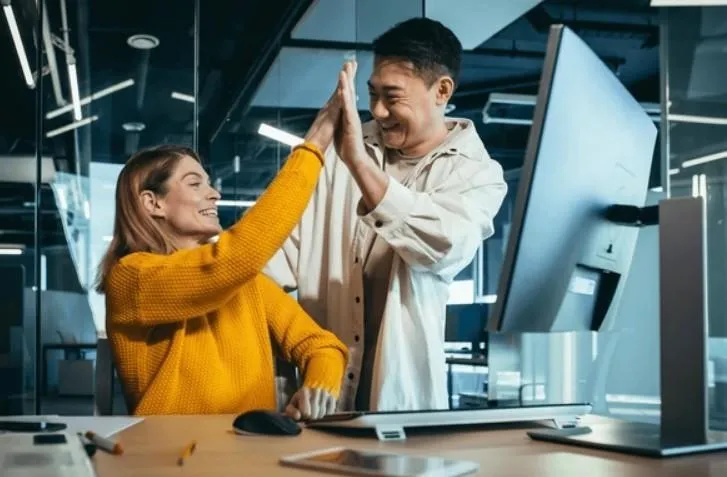 A person and person giving each other a high five
AI-generated content may be incorrect.